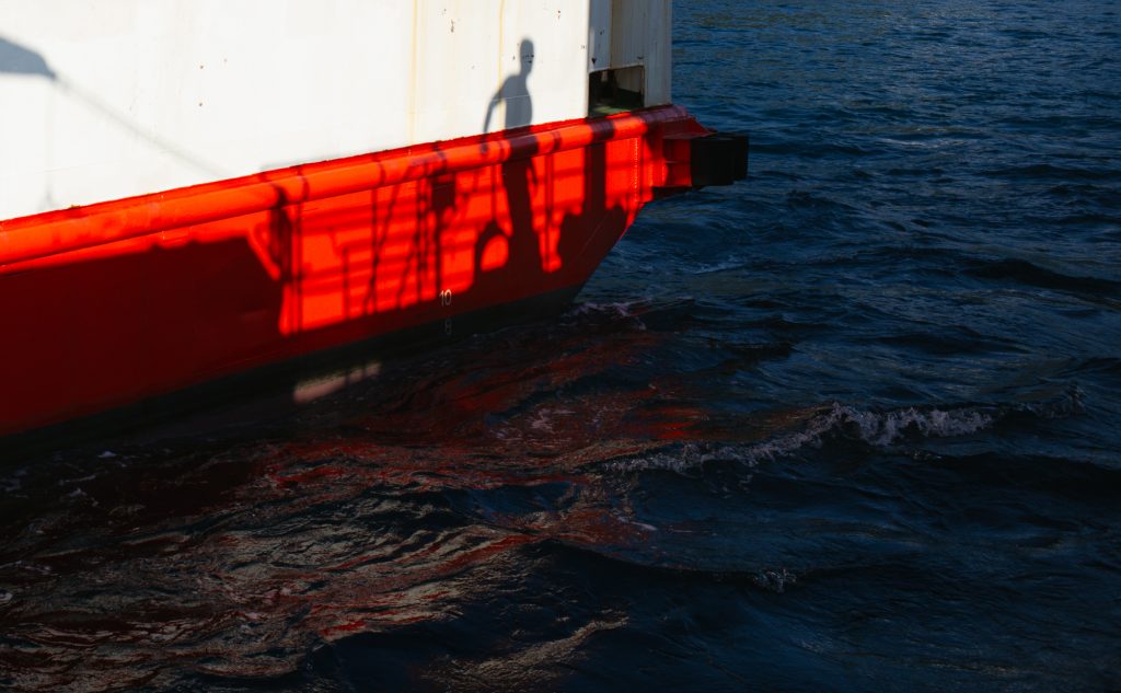 Red. Shadow. Boat.